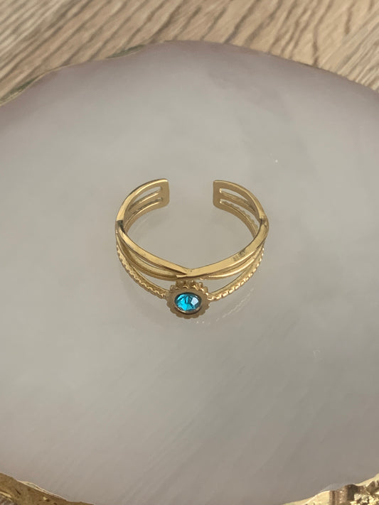 Bague Angèle, ouverte réglable de style moderne/contemporain sertie d'un strass coloré bleu, acier inoxydable doré.