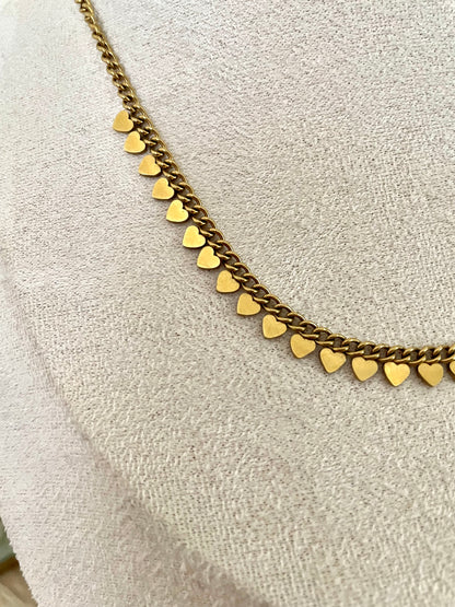 Collier Félicia , petits cœurs acier inoxydable doré.